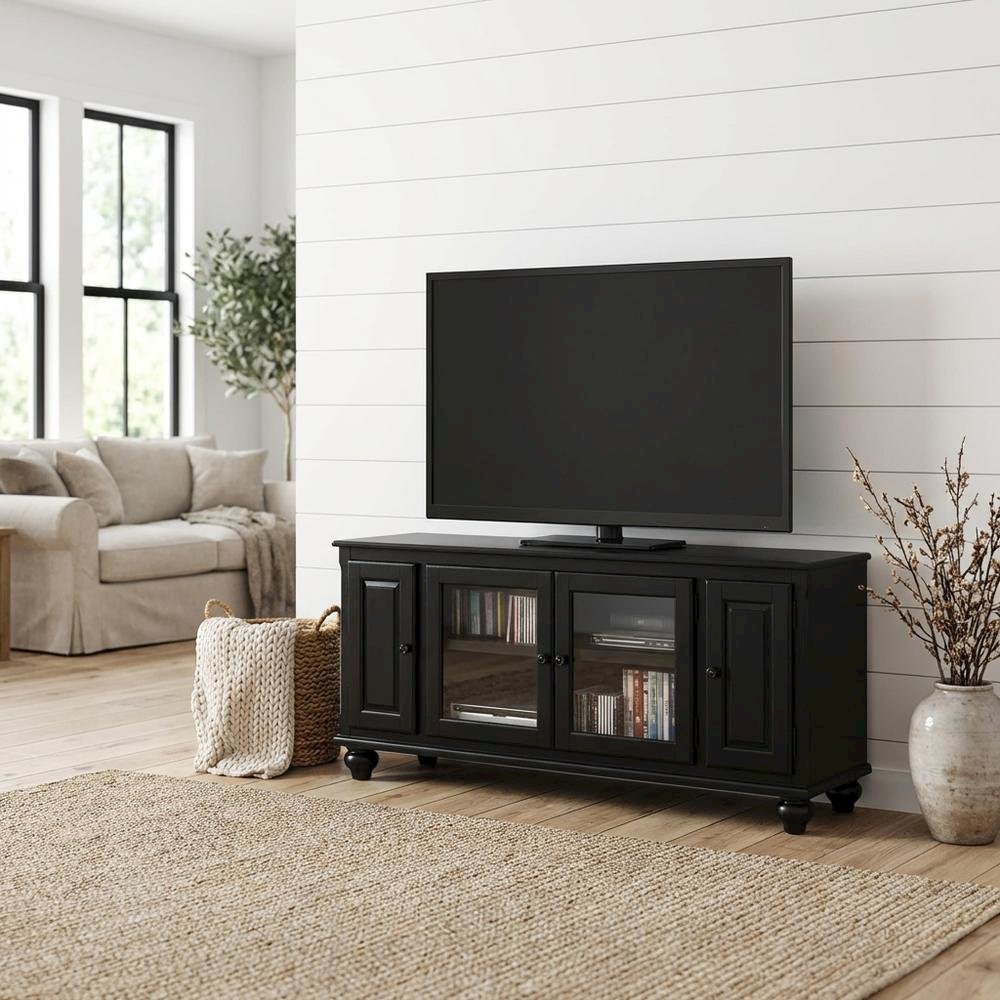 Black wood TV stand with spacious surface and modern design