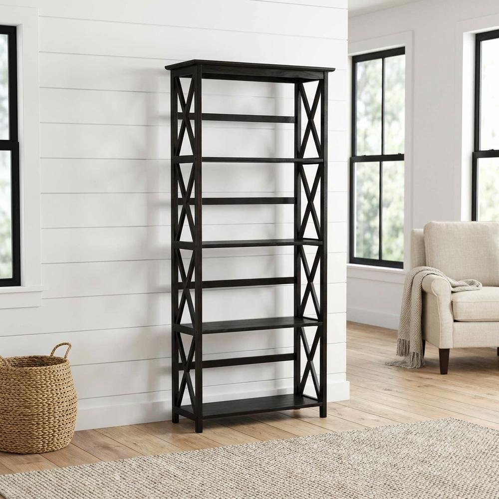 Wooden bookcase with tall open shelves and sturdy construction