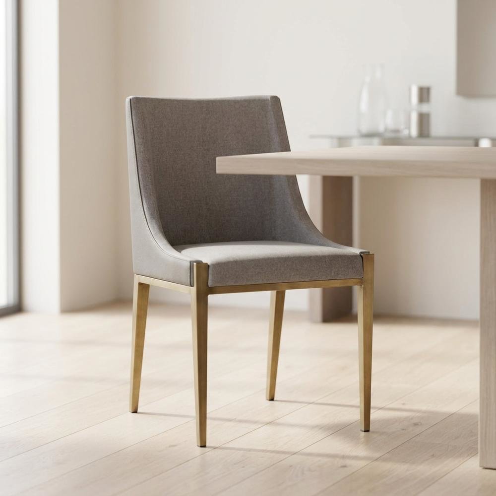 Modern grey and brass dining chair with padded seat and sleek design