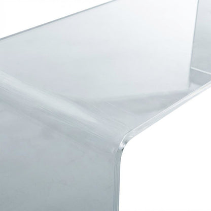 Clear acrylic coffee table with sleek design and lightweight build