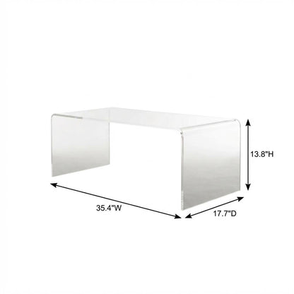 Clear acrylic coffee table with sleek design and lightweight build