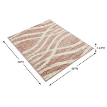 Cream and rose area rug with power loomed polypropylene pile in accent shape