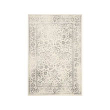 Ivory and Silver Area Rug with Power Loomed Design and Plush Polypropylene Pile
