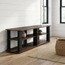 Walnut and black entertainment center with composite wood finish for TV storage