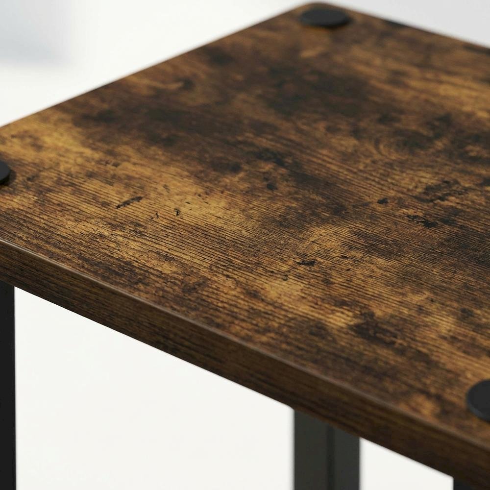 Wooden nightstand in amber pine finish with sleek black accents, compact design