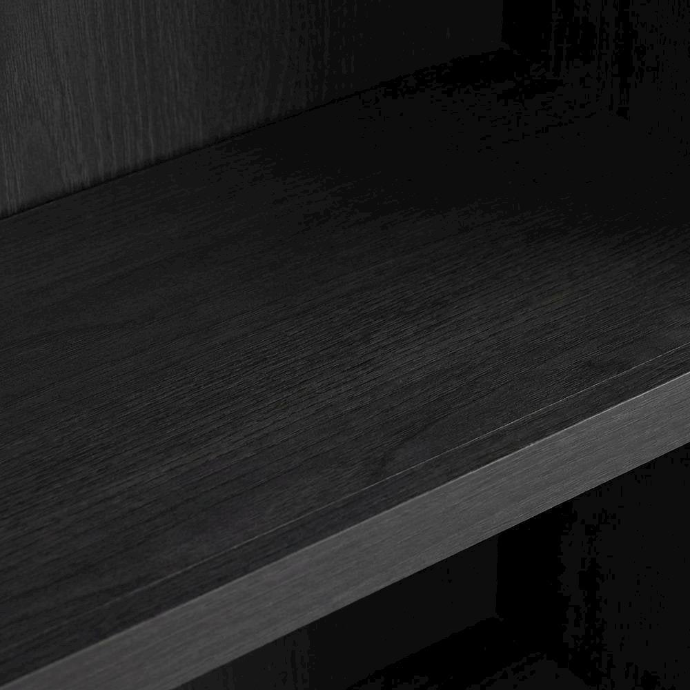 Bookcase in black wood with spacious open shelves for versatile storage