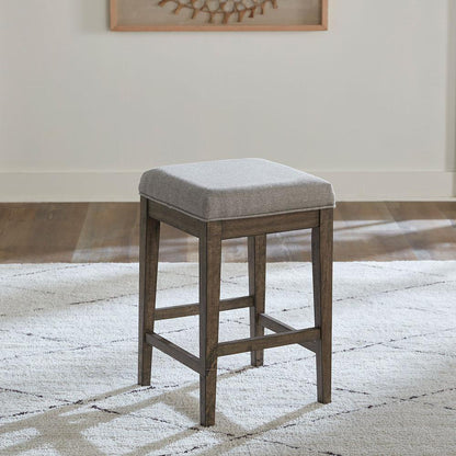 Arrowcreek Upholstered Console Stool in Weathered Stone