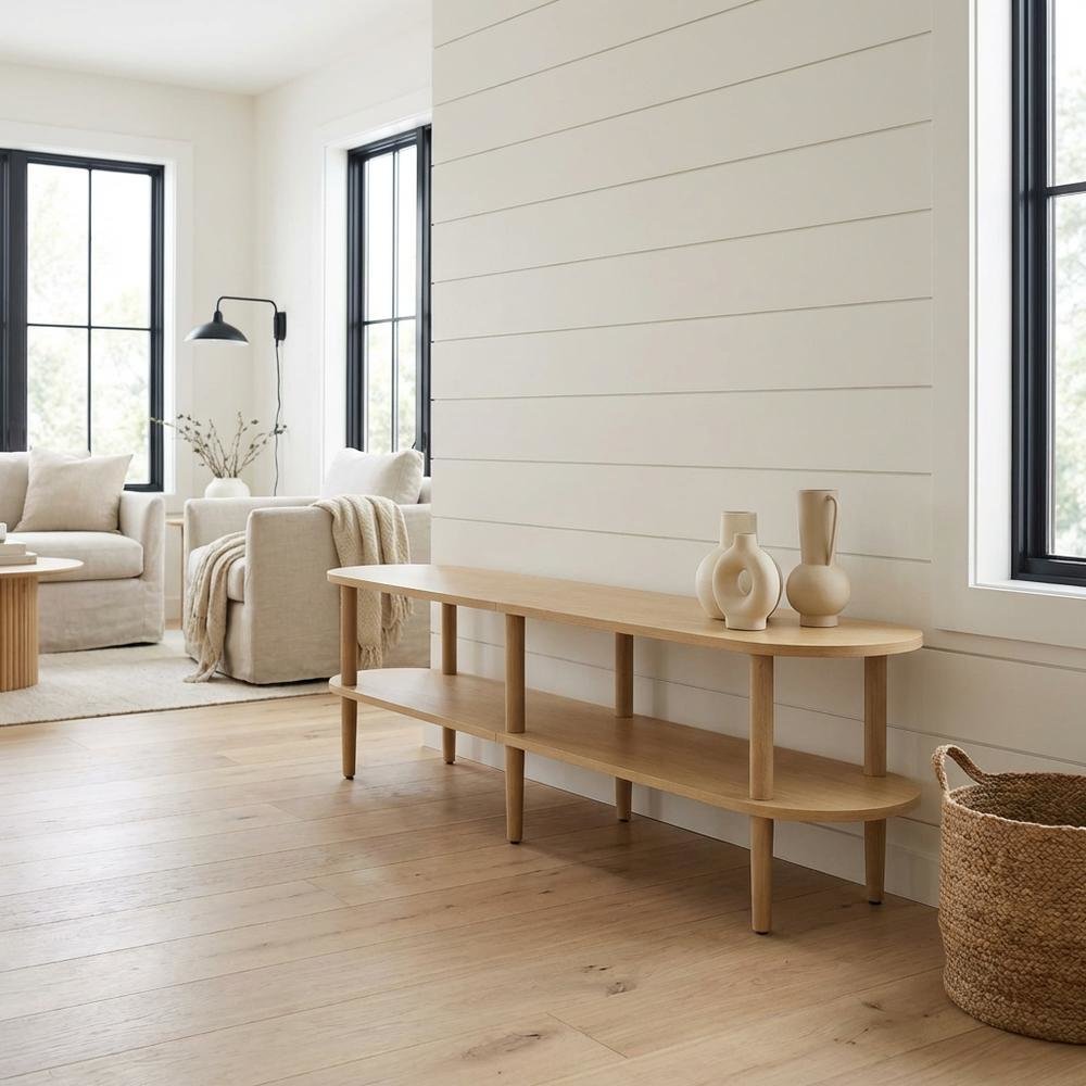 Brown wood TV stand with solid mango construction and oval design