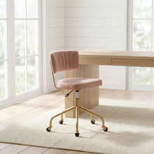 Pink velvet task chair with gold painted steel frame and cushioned seat