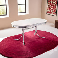 Sleek Silver Oval Dining Table with Glossy White Top and Chrome Accents