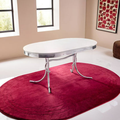 Sleek Silver Oval Dining Table with Glossy White Top and Chrome Accents