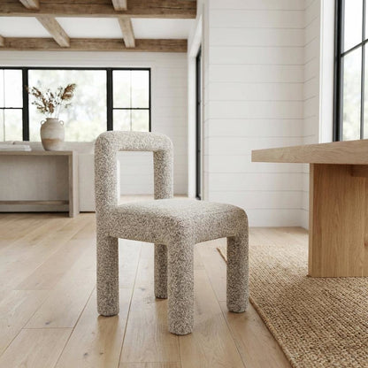 Gray boucle fabric dining chair with fiber-wrapped foam seat and plywood support