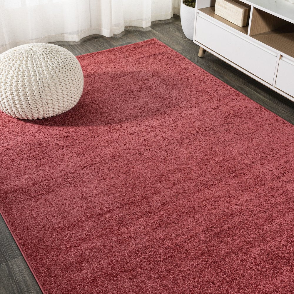 Haze Solid Low Pile Area Rug Red