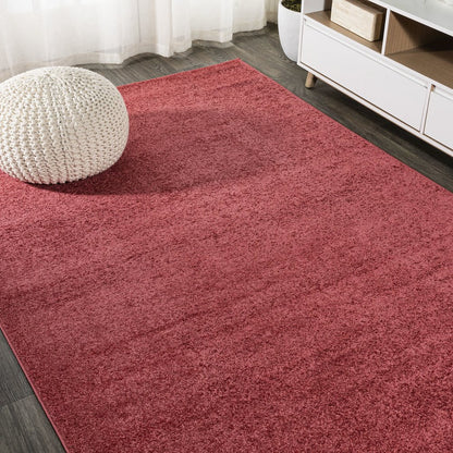 Haze Solid Low Pile Area Rug Red