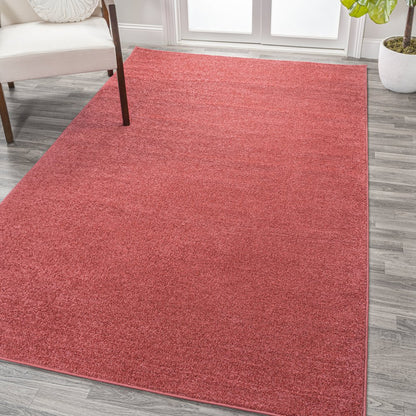 Haze Solid Low Pile Area Rug Red