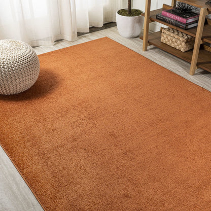 Haze Solid Low Pile Area Rug Orange