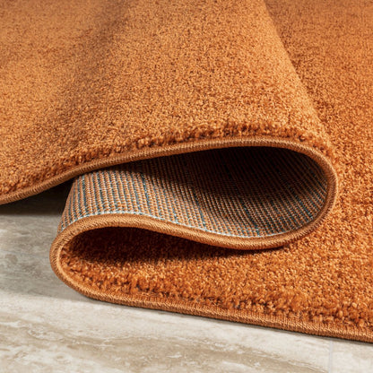 Haze Solid Low Pile Area Rug Orange