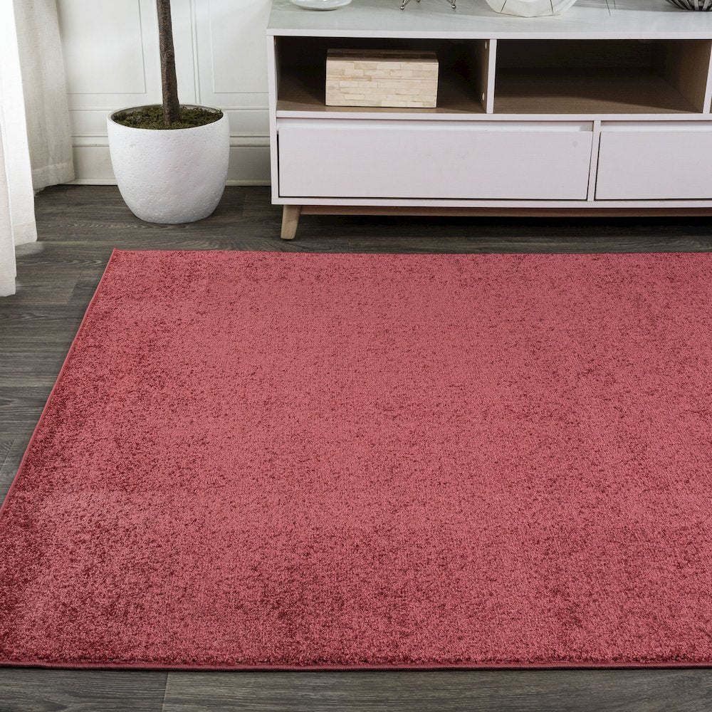 Haze Solid Low Pile Area Rug Red