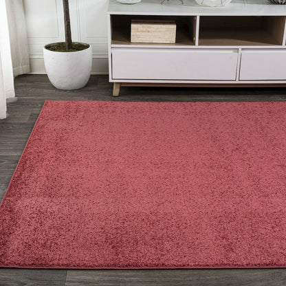 Haze Solid Low Pile Area Rug Red