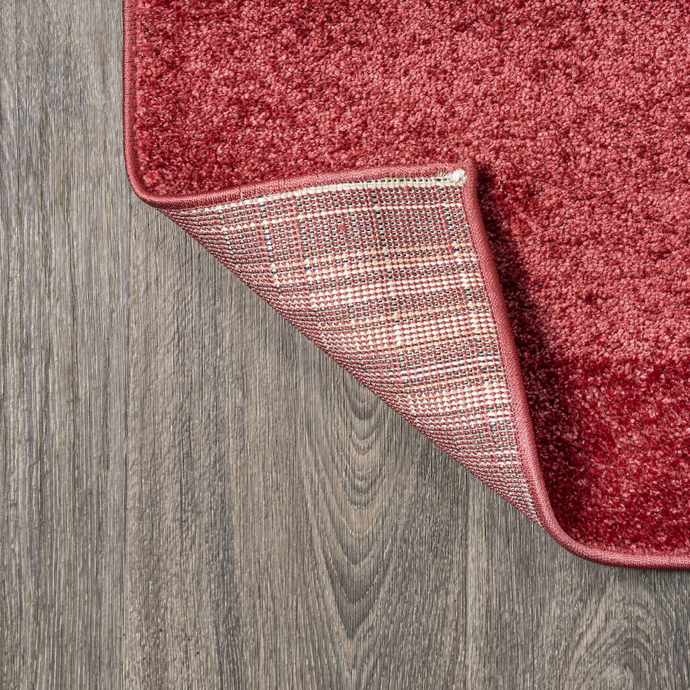 Haze Solid Low Pile Area Rug Red