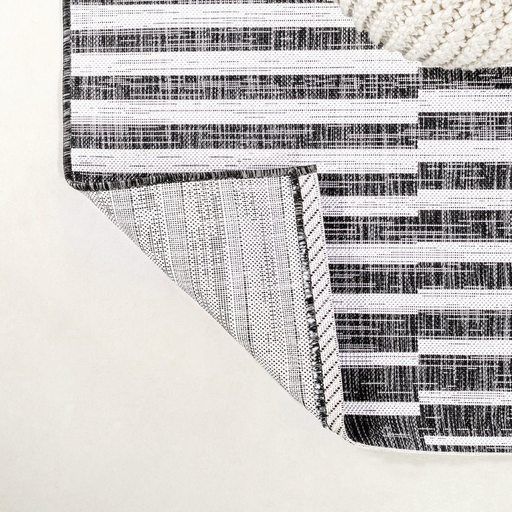 Sukie Modern Offset Stripe Indoor/Outdoor Area Rug
