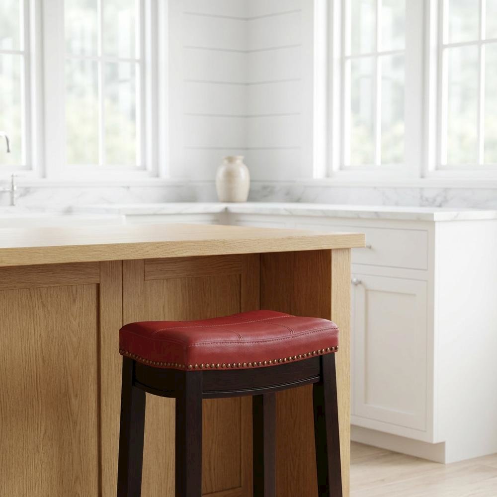 Red counter stool with rubberwood frame and cushioned faux leather seat