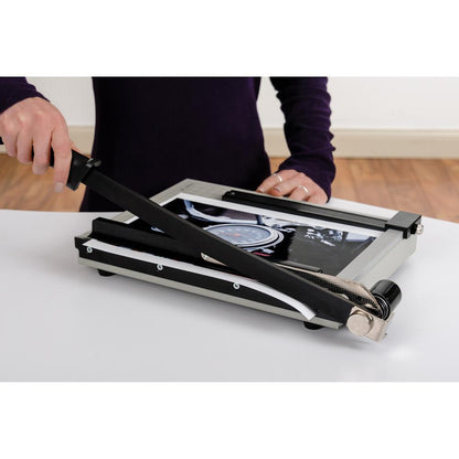 Dahle NA Vantage Guillotine Paper Trimmer - 15 Sheet Cutting Capacity - 12" Cutting Length - Sturdy, Spring-action Handle, Adjustable Back Stop, Alignment Grid - Metal - Gray - 10.3" Length - 1 / Cart