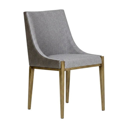 Modern grey and brass dining chair with padded seat and sleek design