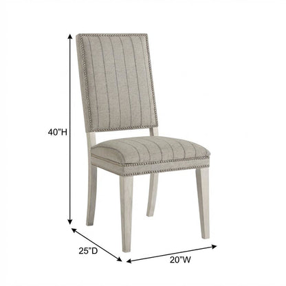 Sandbar-colored dining chair pair with distressed finish and stylish design