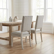 Sandbar-colored dining chair pair with distressed finish and stylish design