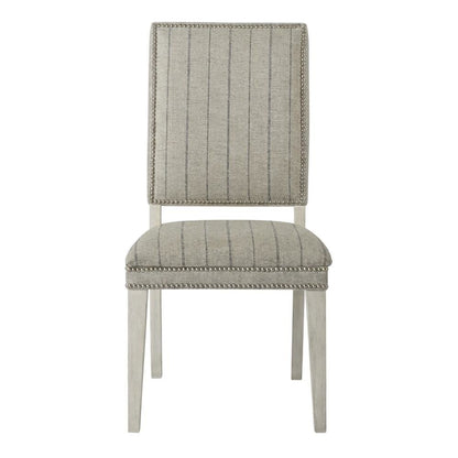 Sandbar-colored dining chair pair with distressed finish and stylish design