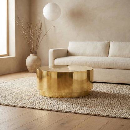 Contemporary Gold Coffee Table with Drum Legs and Stylish Finish