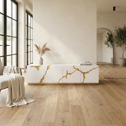 White engineered wood TV stand with sleek gold accents for modern living spaces