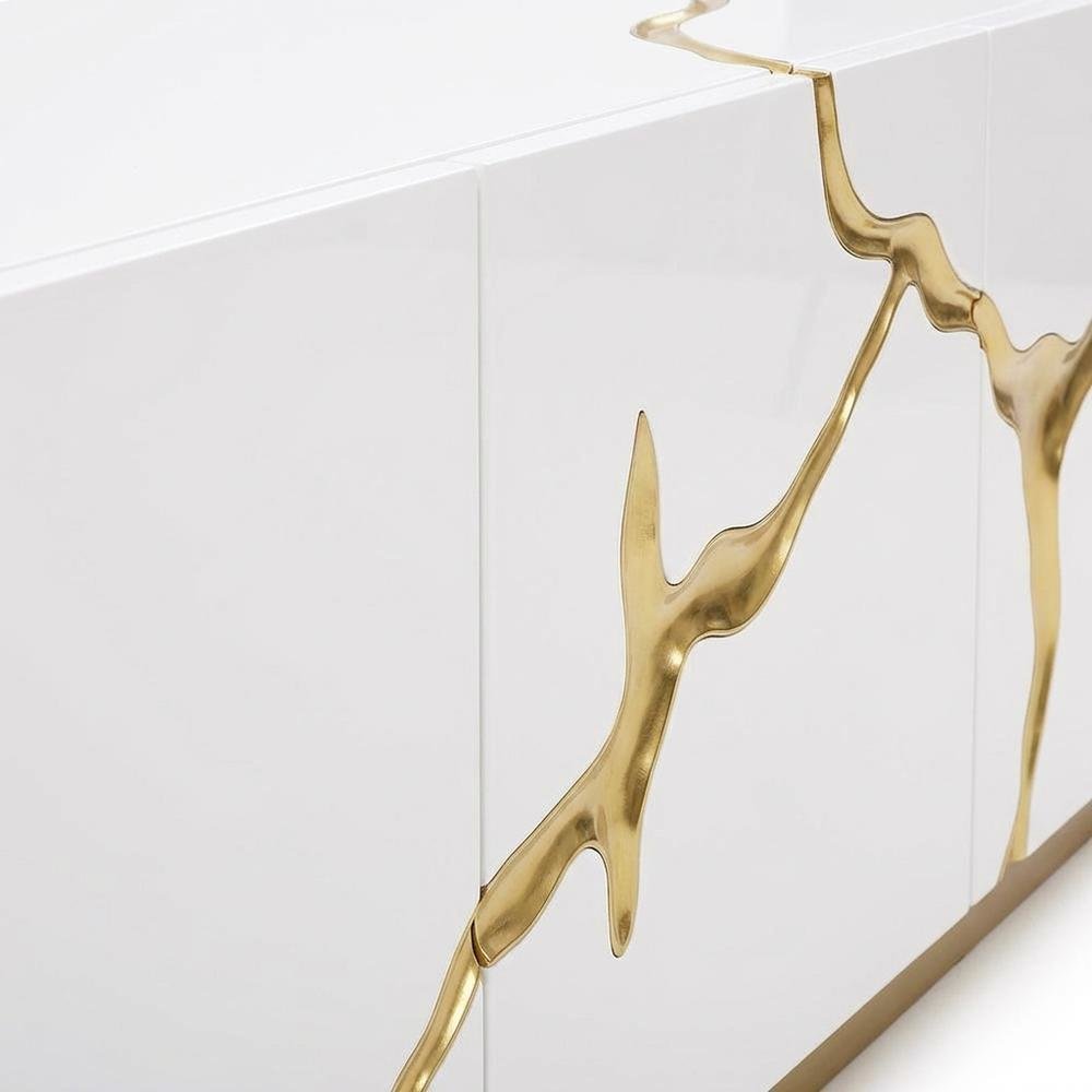 White engineered wood TV stand with sleek gold accents for modern living spaces